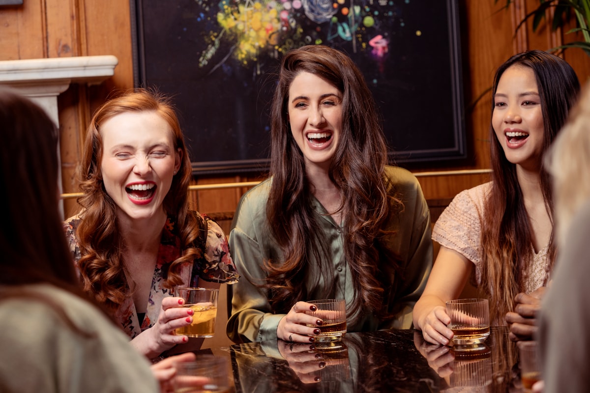 Friends enjoying cocktails at a bar on a hen night in London