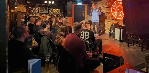 Comedian performing at JK Comedy Club