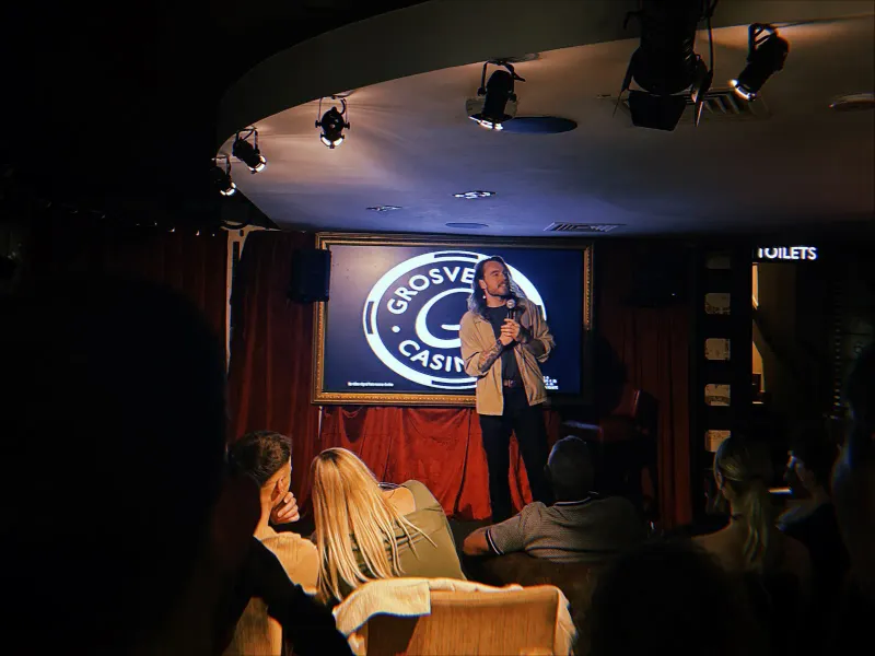 Comedian performing at JK Comedy Club Leicester Square